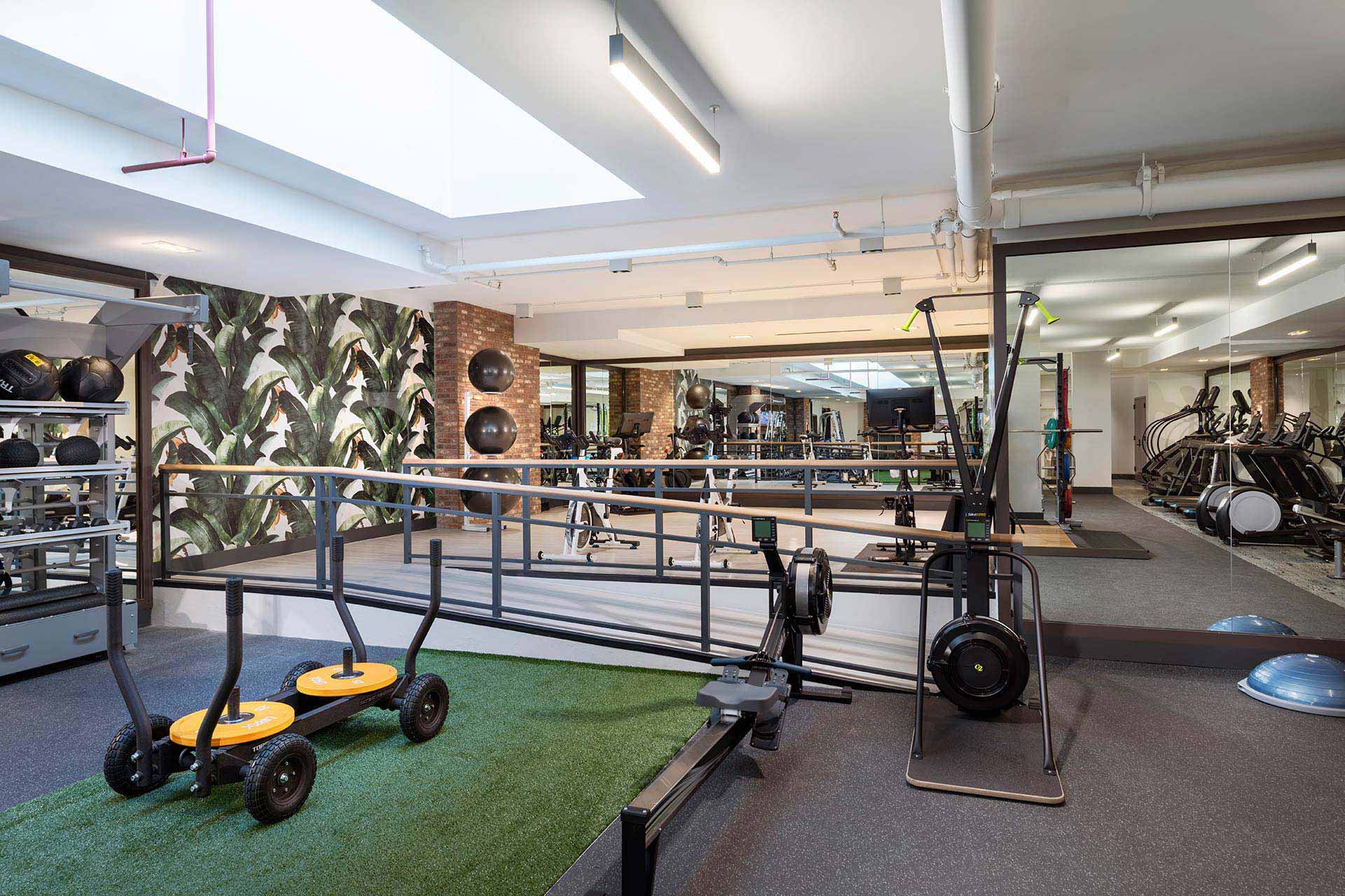 gym with yoga and spin studio area